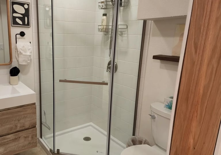 Airbnb turnover bath โ shower glass and vanity spot-free